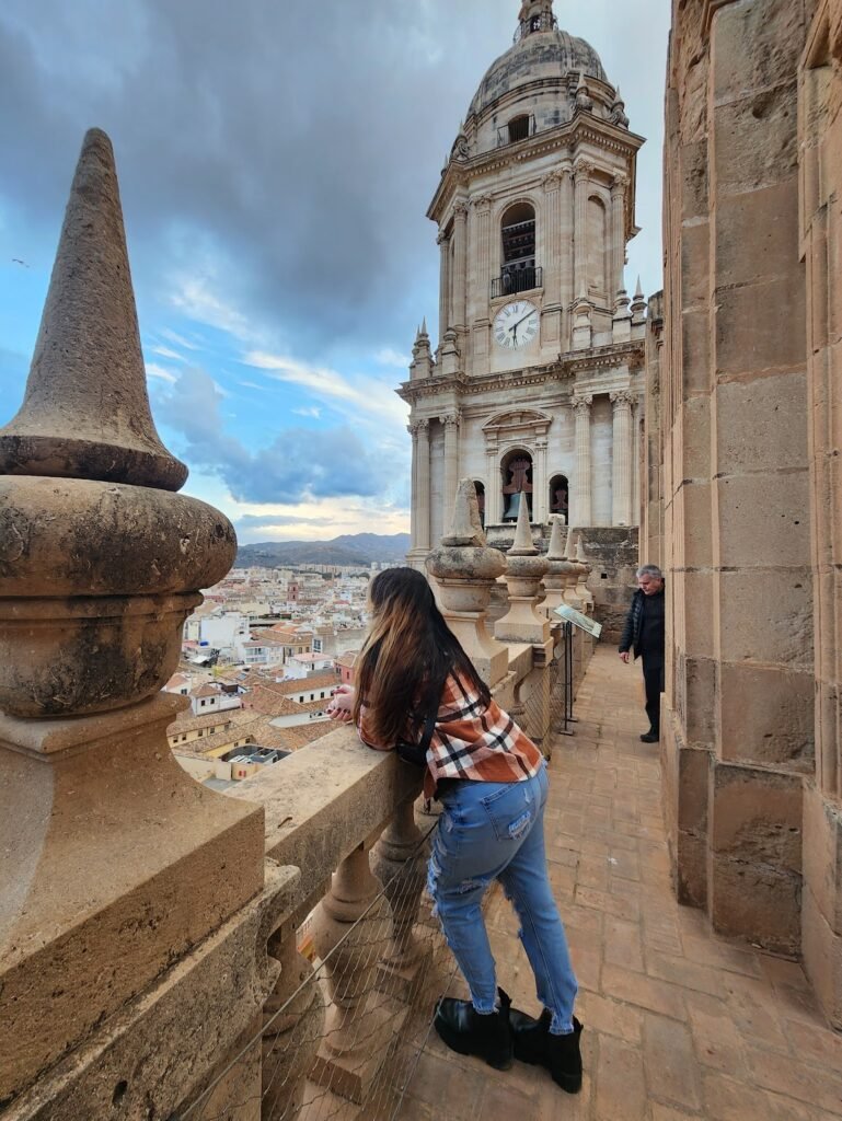 Sunset view of Málaga, Spain with the cathedral below, capturing romantic travel inspiration for couples exploring new places.