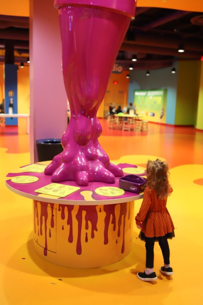 Kids creating personalized crayons at Crayola Experience