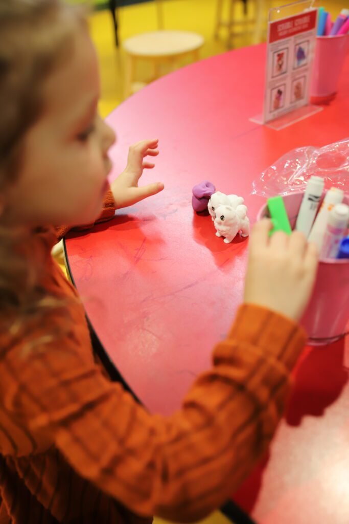 Family enjoying interactive activities at Crayola Experience