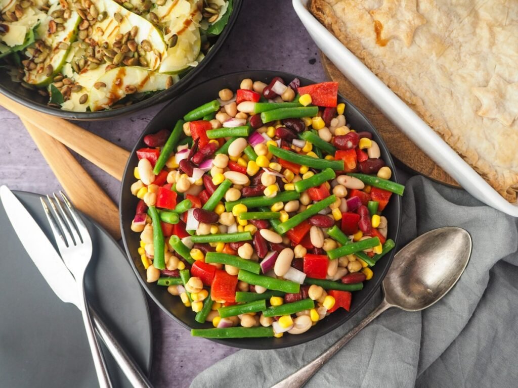 Four bean salad in a serving bowl, an easy-to-make side dish for healthy meal prep ideas recipes and healthy New Year food options