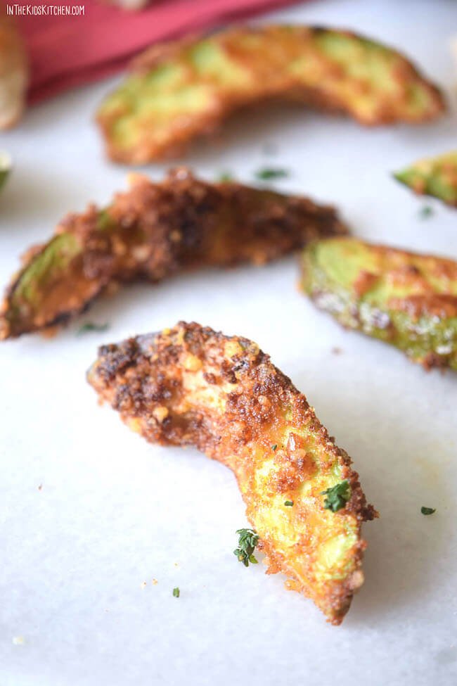 Healthy baked avocado fries served with dipping sauce, a crunchy snack idea for healthy recipes for New Year celebrations and kids