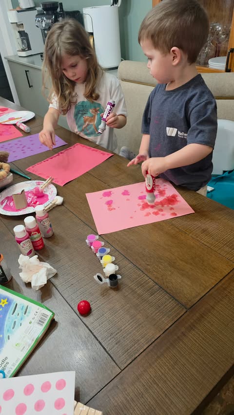 Kids Decorating Paper Hearts for Banner
