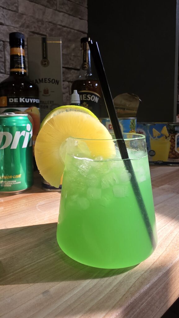 Green Irish Whiskey Cocktail for St. Patrick's Day with Shaker and Ingredients