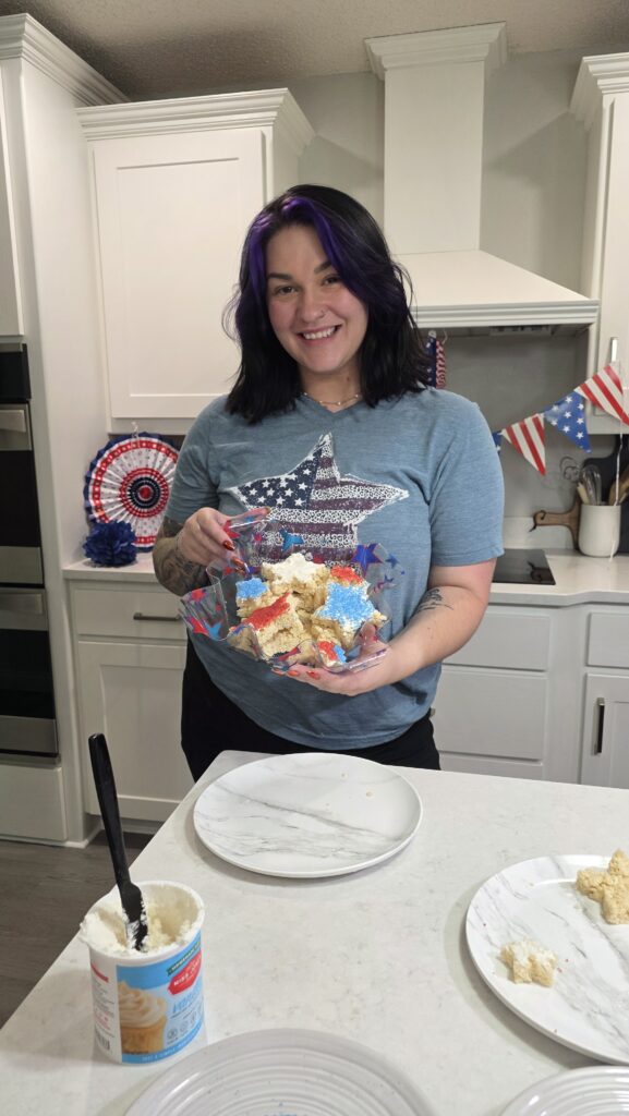 Lexie posing with the finished Rice Crispy Treats she made
